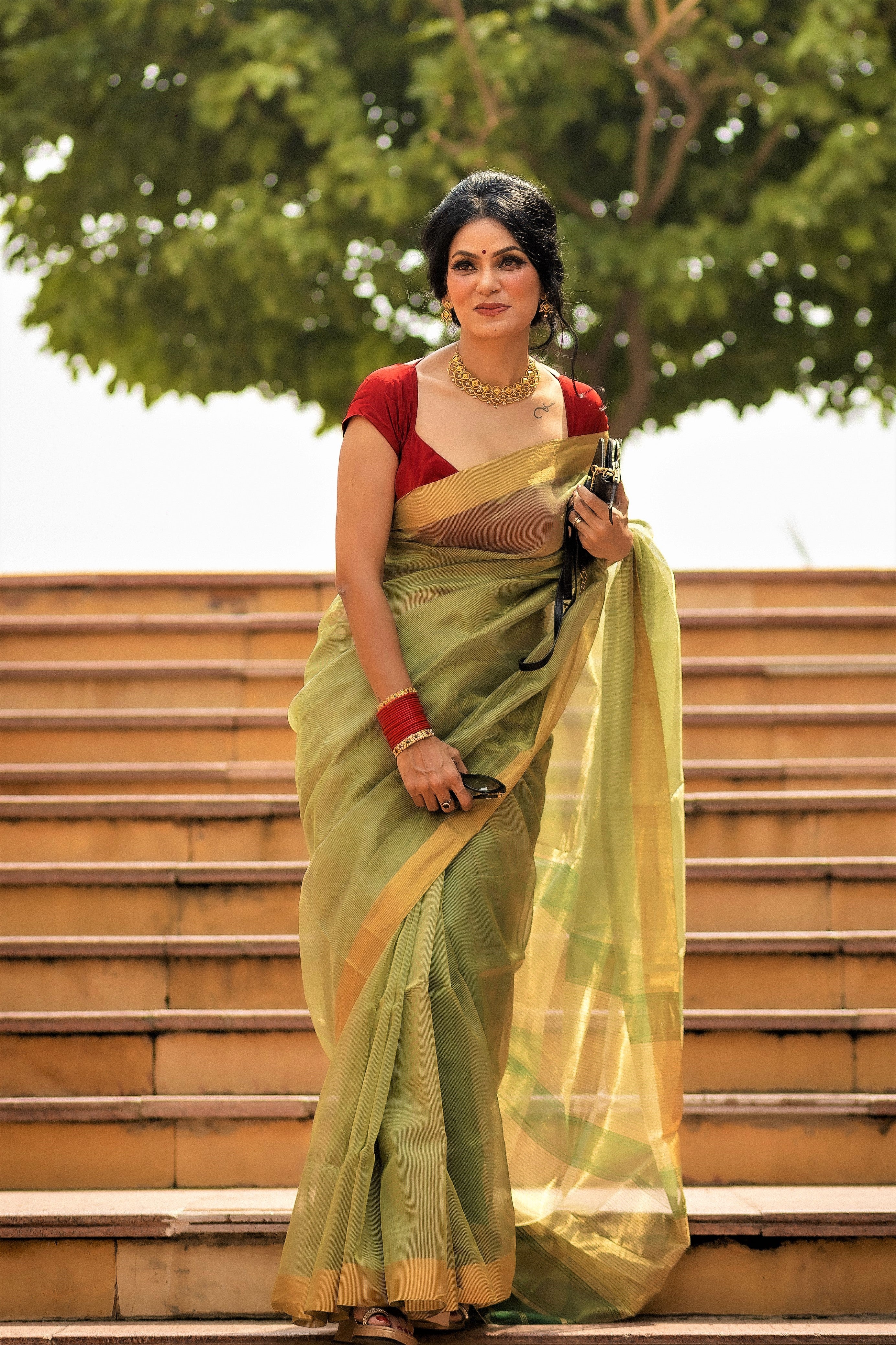 Green maheshwari saree with zari lines all over